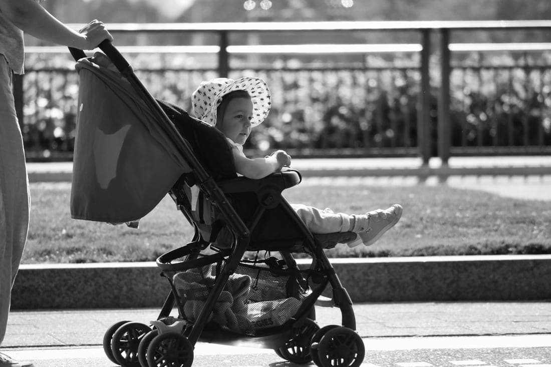 A side-by-side double stroller with two seats