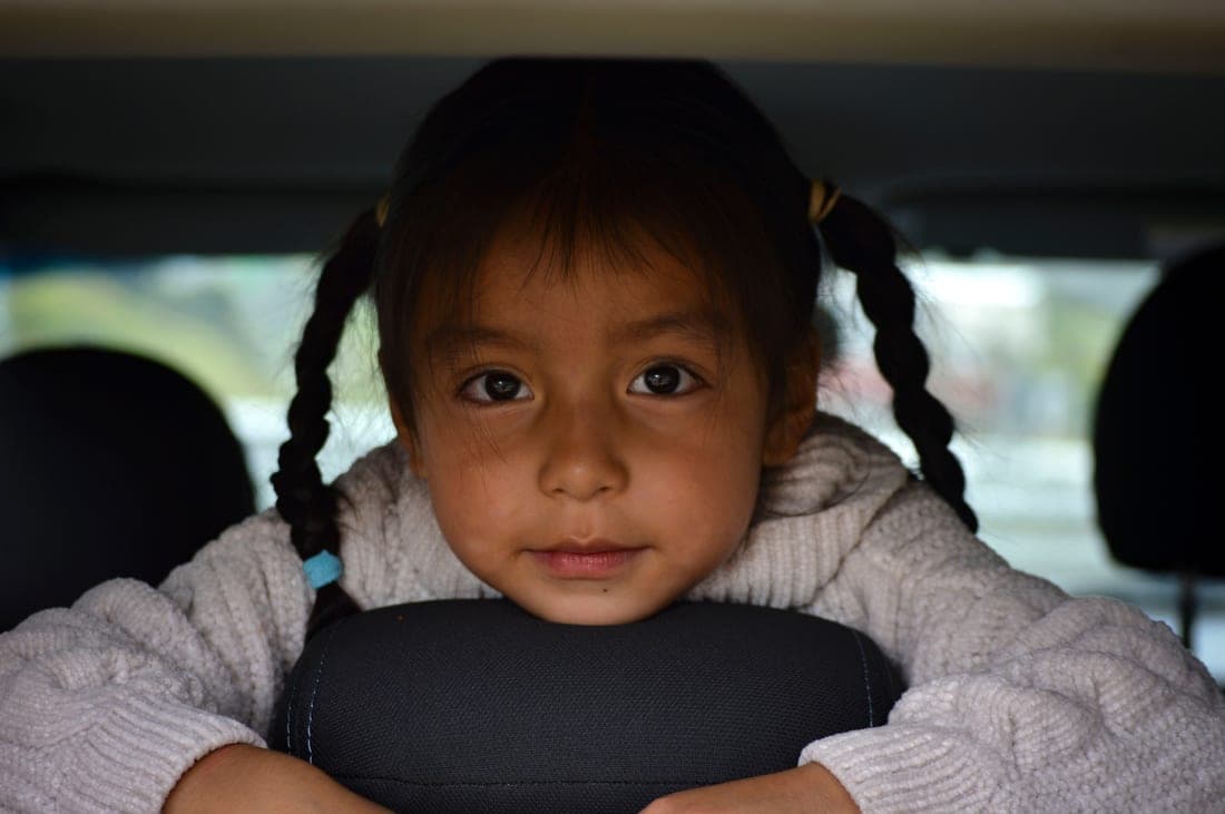 A one-year-old riding rear-facing in a convertible car seat
