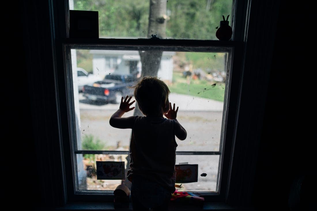 A five-year-old child buckled into a forward-facing car seat