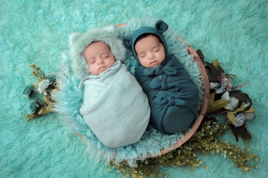 A double stroller set up for two infants