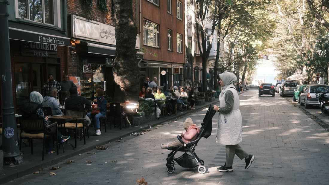 A stroller with an infant car seat clicked onto the frame