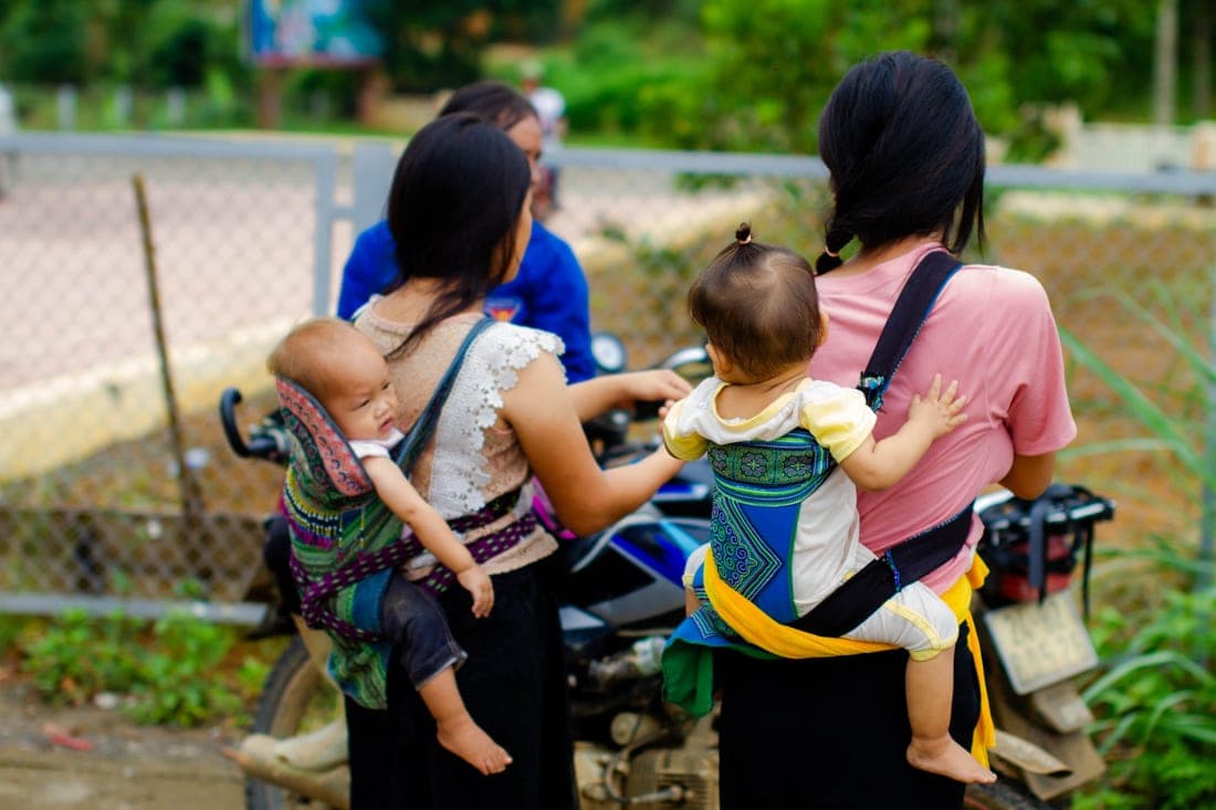 A folding car seat stroller next to a conventional infant car seat