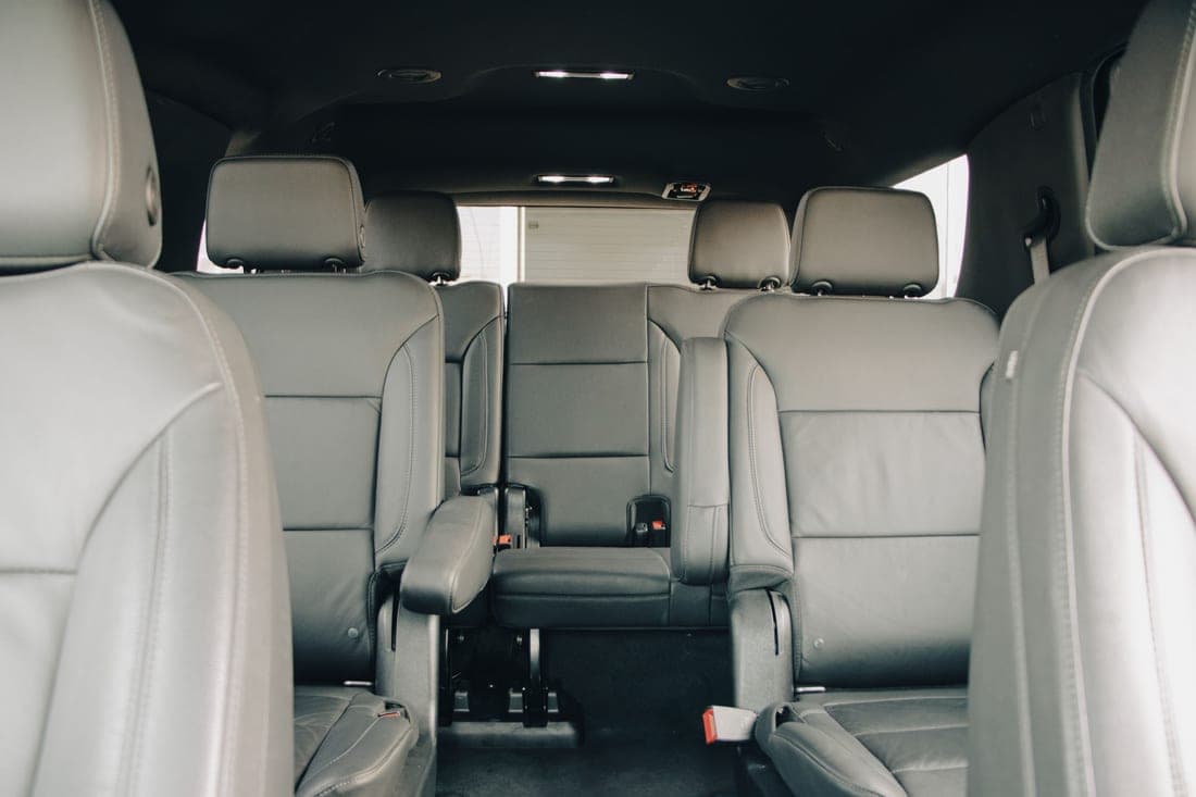 The rear bench of a car showing three seating positions
