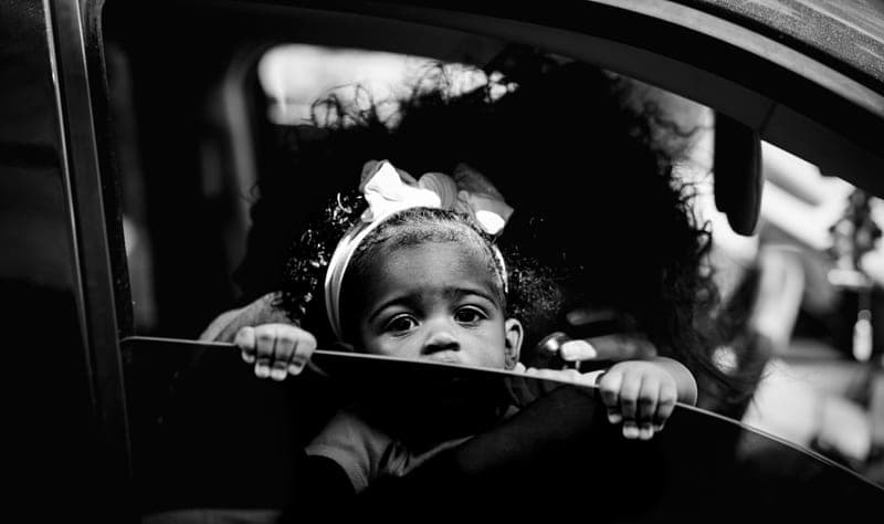A young child riding in a car seat — category photo, not this specific model