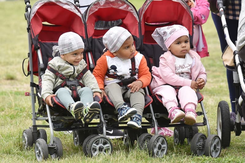 Two children riding in a double stroller — category photo, not this specific model